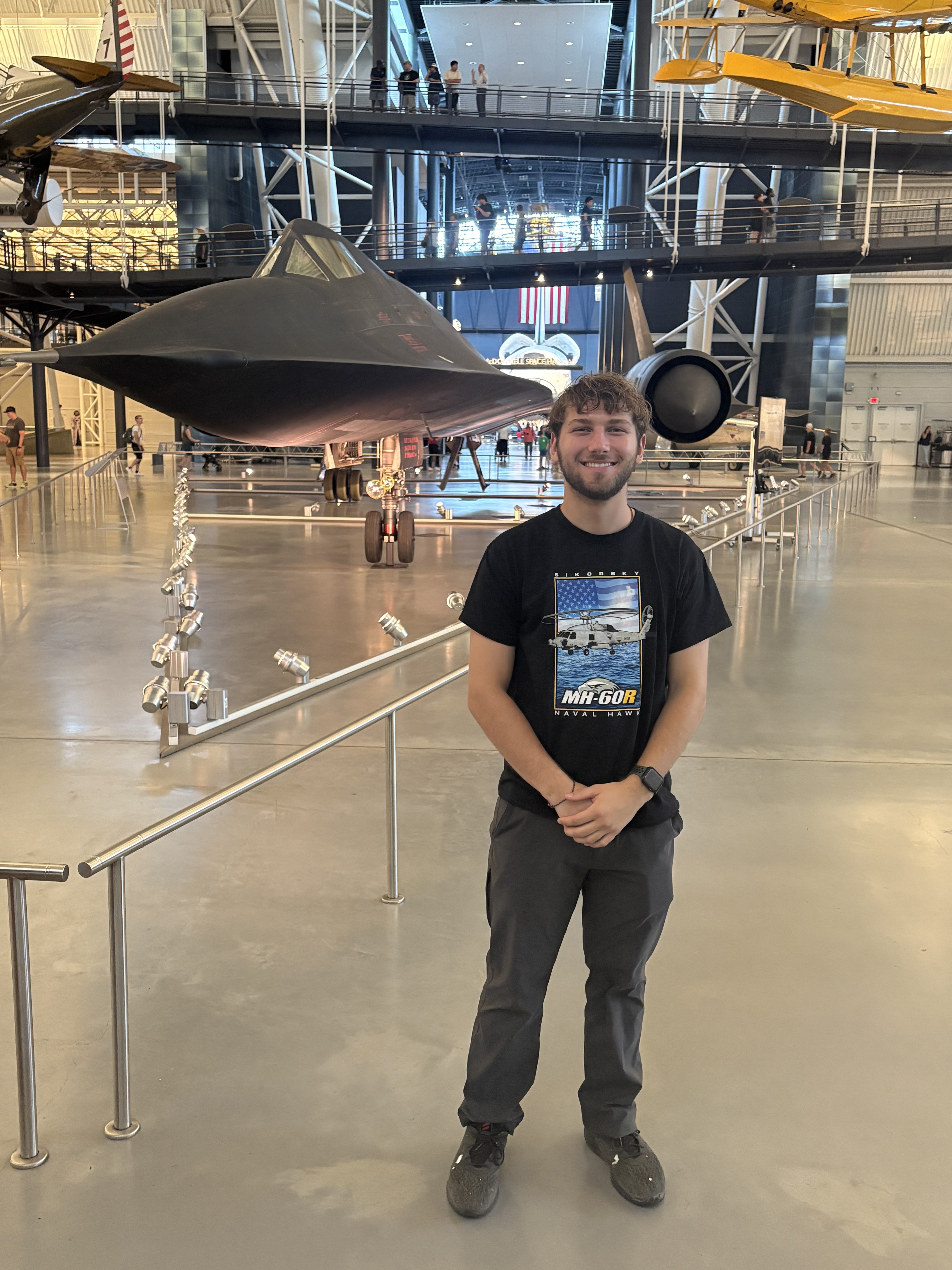Travis with plane behind him