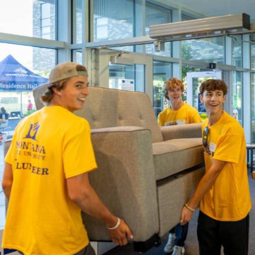 students moving a couch