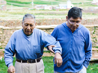 Young man helping grandfather