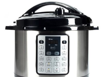an example of a pressure cooker with a digital display and buttons, a handle that spans the lid, and a release valve.