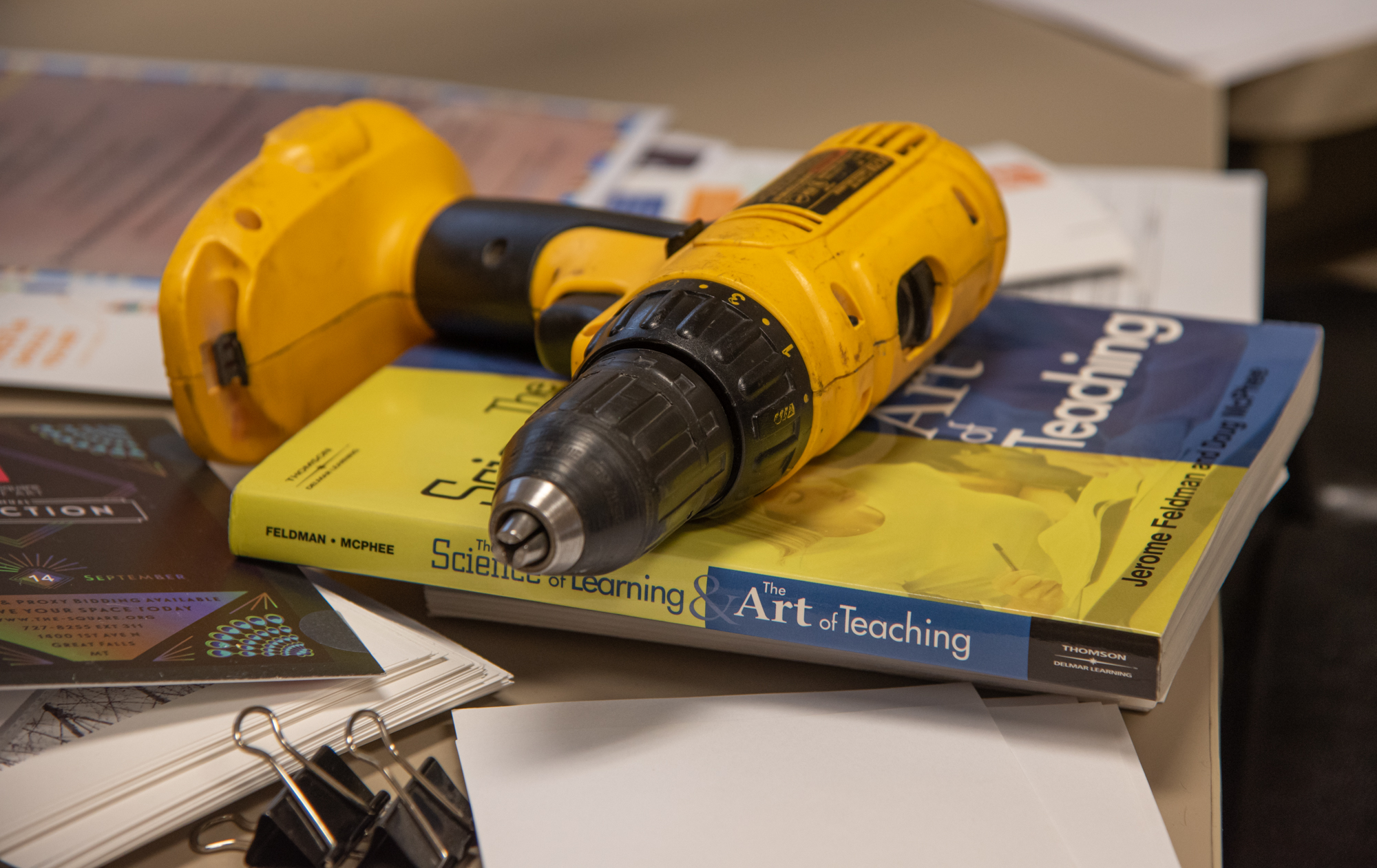 Drill on top of a book