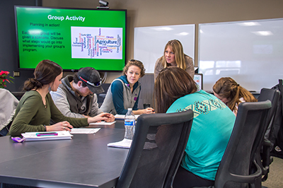 Teaching with students in classroom.