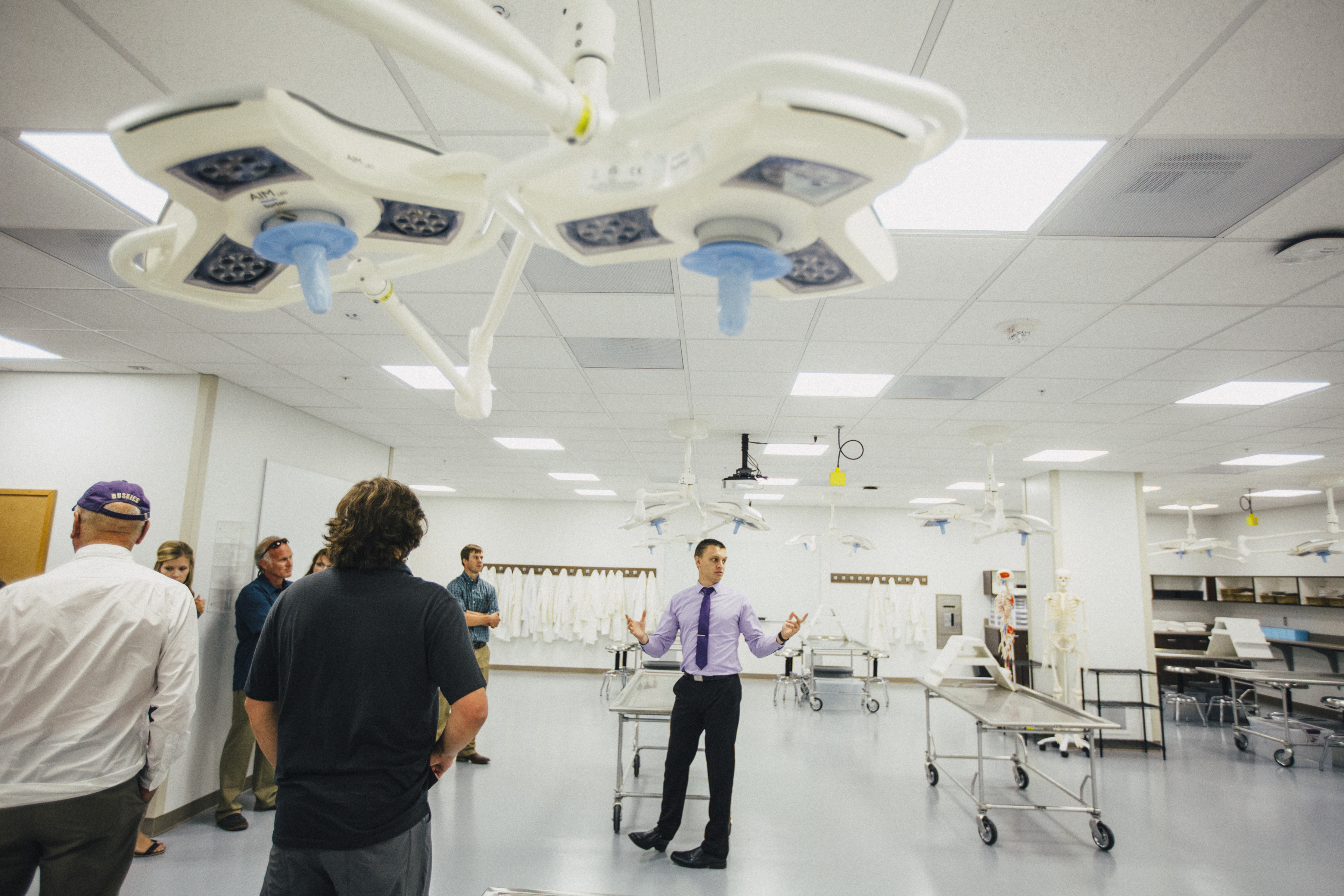 small group of people touring a lab at MSU