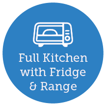 Full kitchen with refrigerator and range