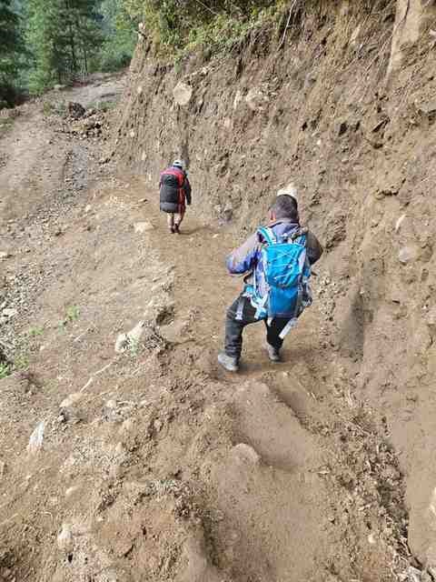 The muddy trail heading away from Lukla