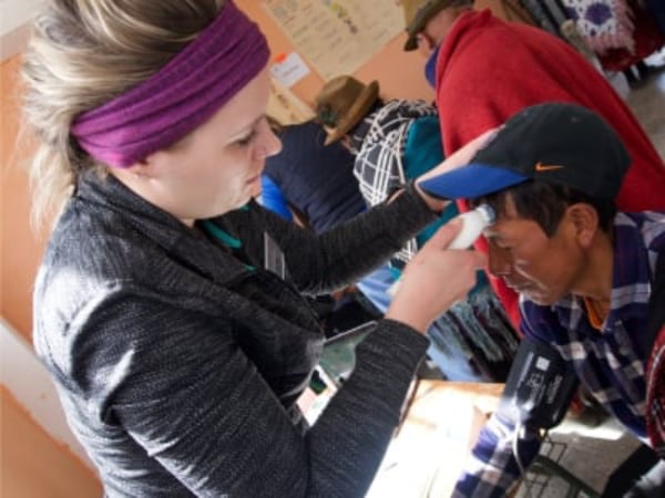 Taking patient's temperature in Ecuador