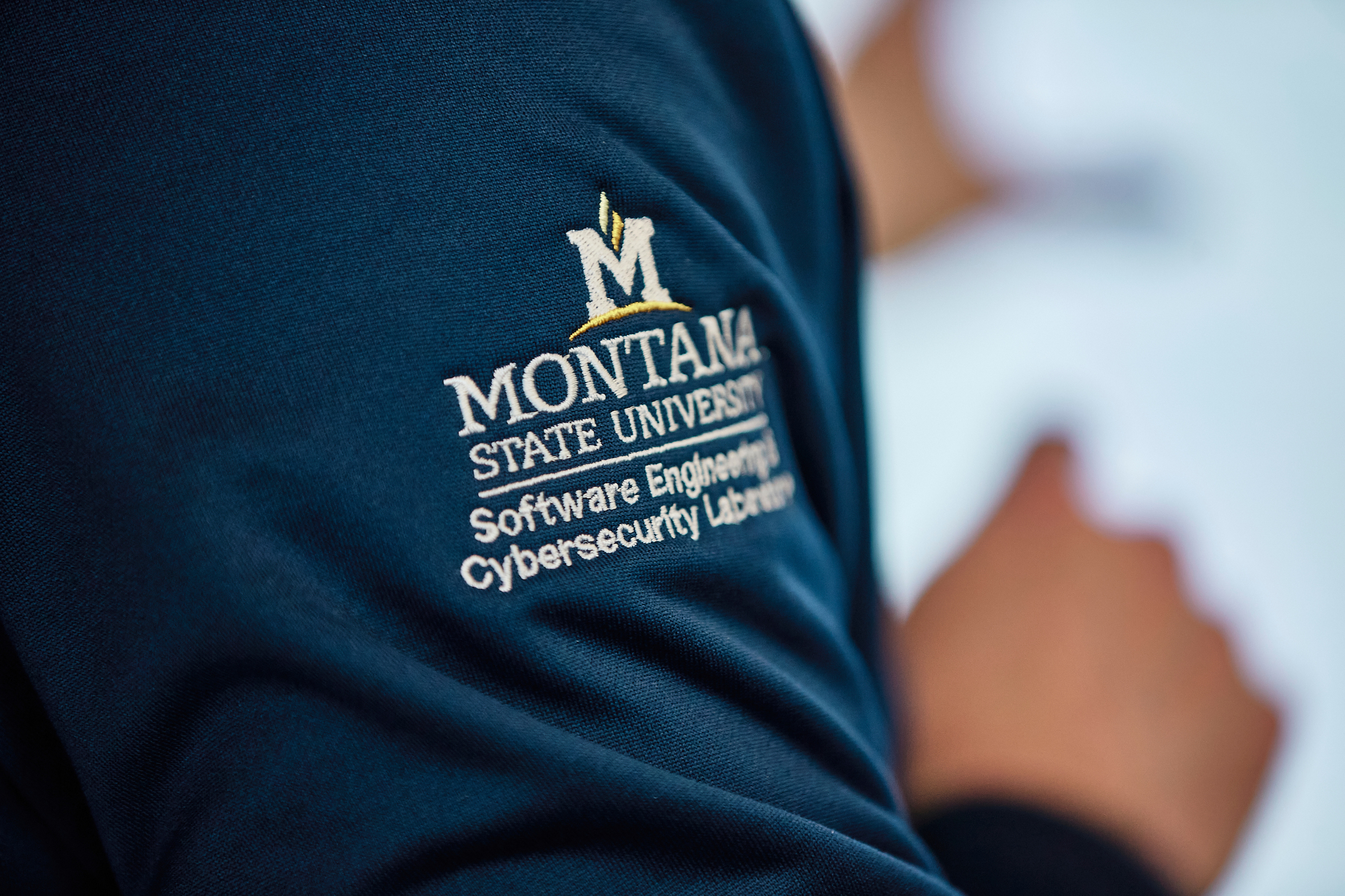 blue jacket sleeve with MSU logo