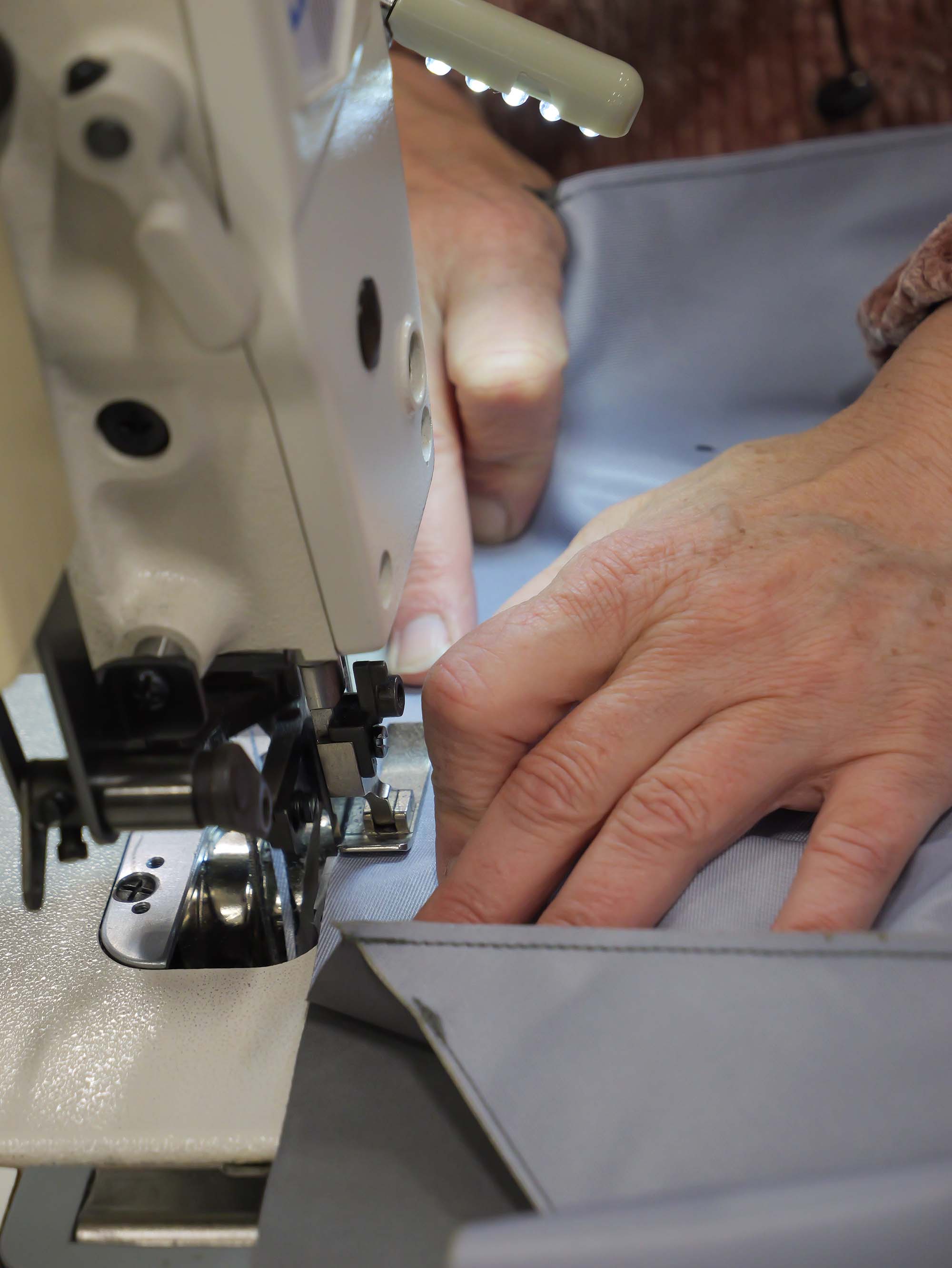 hands and sewing machine