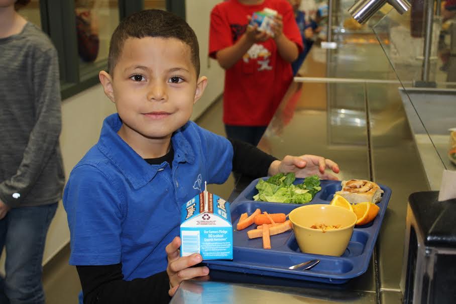 Boy with lunch tray