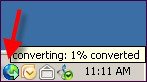 Screenshot showing the tiny world/globe conversion icon located in the system tray.